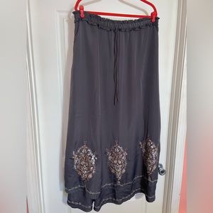 NWT woman’s garment in sz 12, color is like dark grey with beautiful stitching.